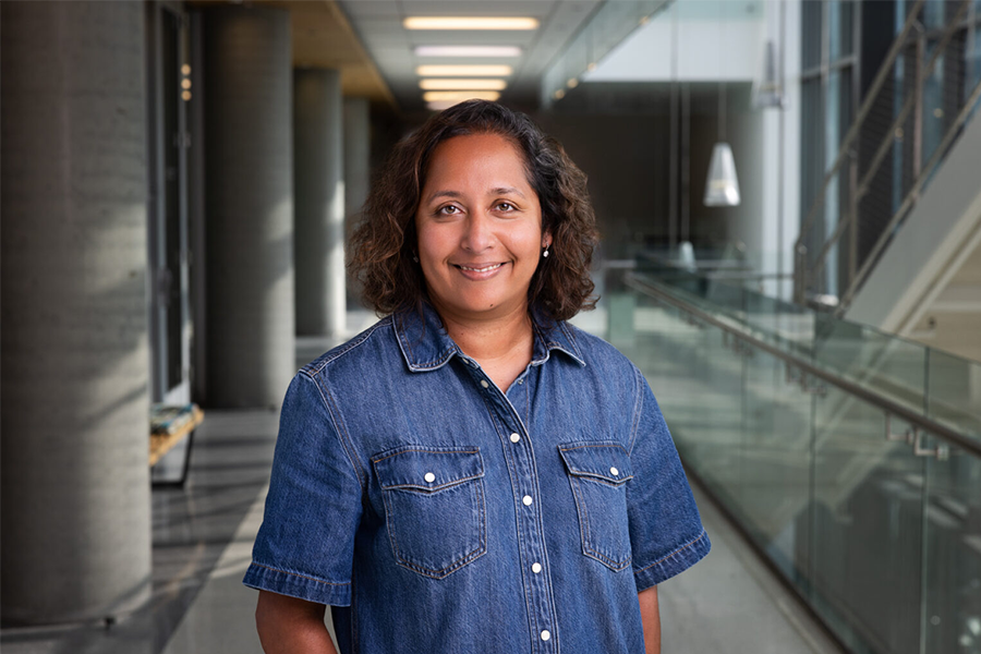 LMU professor Deepa Dabir standing in LMU Life Sciences Building.
